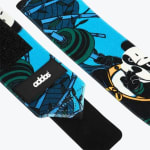 Close-up of blue Addos wrist wraps with a cartoon panda lifting a barbell.