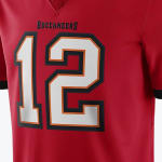 Close-up of a red Tampa Bay Buccaneers football jersey with the number 12 printed on the front.