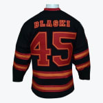The back of a black hockey jersey showing the name BLASKI and the number 45 in red with orange outlines.