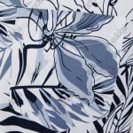 Close-up of a white shirt pocket with a blue and black tropical floral pattern and faint Addos logos.