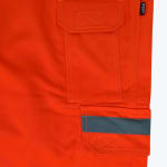 A close-up of bright orange cargo work pants with two side pockets, one featuring a grey reflective stripe.