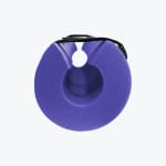 A circular purple foam barbell pad with a black strap on a white background.