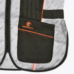 Close-up of a white mesh Hawkvest shooting vest with dark green pockets, orange trim, and an embroidered orange hawk logo.