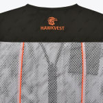 Close-up of the back of a black and grey mesh vest featuring an orange embroidered hawk logo and the text 'HAWKVEST' on the black upper panel.