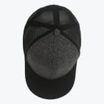 Top-down view of a trucker hat with a heather grey front panel, black visor, and black mesh back panels on a white background.