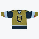 A gold and dark blue hockey jersey with a cartoon knight mascot crest in the center, laid flat against a white background.
