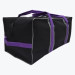 A rectangular black duffel bag with purple handles and grey trim, isolated on a white background.