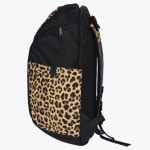 Side view of a black backpack with a leopard print front pocket and shoulder straps against a white background.