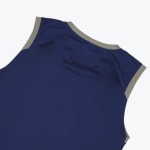 Close-up of the upper back of a navy blue sleeveless athletic top with grey trim around the collar and armholes.