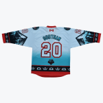 The back view of a white and teal hockey jersey with SOUTHAM and the number 20 printed on it, featuring Pacific Northwest Indigenous-style artwork on the sleeves and hem.