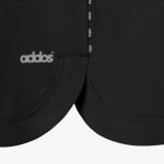 Close-up of a black athletic garment with a curved hem, featuring the word addos printed in grey on the left.