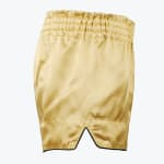 A pair of gold satin boxing shorts with a thick elastic waistband and black trim on the hem, shown against a white background.