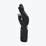 Side profile of a black leather MMA sparring glove standing vertically on a white background, showing its segmented finger padding and wrist support.