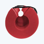 A circular red foam barbell pad with a black velcro strap, shown against a plain white background.