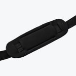 Close-up of a black padded shoulder strap pad threaded onto a black nylon strap against a white background.