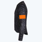 Side view of a dark grey patterned long-sleeve cycling jersey with a bright orange band on the upper sleeve.