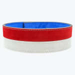 A circular weightlifting belt with a red and white suede exterior and a blue suede interior, featuring white stitching.