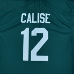 The back of a dark teal sports jersey with the name CALISE and the number 12 in white block font.