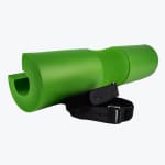 A bright green foam barbell squat pad with a central neck groove and two black velcro security straps on a white background.