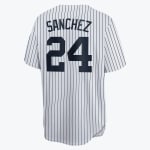 Back view of a white New York Yankees baseball jersey with navy pinstripes, featuring the name SANCHEZ and number 24 in navy blue.