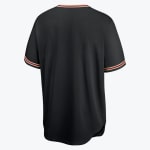 The back of a blank black baseball jersey with red and gold striped trim on the collar and sleeve cuffs, isolated on a white background.