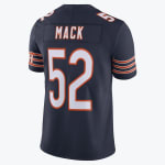 Back view of a navy blue Chicago Bears jersey with MACK and the number 52 printed in white and orange.