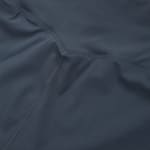 Close-up of smooth, dark grey athletic fabric featuring a curved flatlock seam.