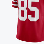 Close-up of a red football jersey with the number 85 printed in large white block numbers.