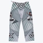 Grey and white roller hockey pants with green stripes and a cartoon sauce can character holding a hockey stick with GET SAUCY text.