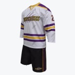 A black short-sleeve mesh jersey with purple and gold accents, featuring WOLVERINES text, claw marks, and the number 23 on the chest, paired with matching black shorts, displayed on a white mannequin against a plain white background.