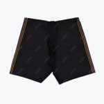 A flat lay view of black addos athletic shorts with a repeating diagonal logo pattern and purple and gold stripes on the sides.