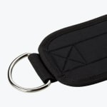 A close-up of a black padded ankle strap with a silver metal D-ring on a white background.