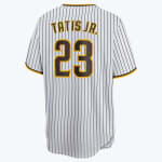 Back view of a white and black pinstriped San Diego Padres baseball jersey with TATIS JR. and the number 23 in gold and brown.