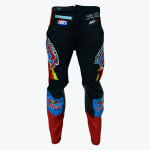 Rear view of black motocross pants with red and blue accents, featuring Red Bull, Fox, and Motorex logos.