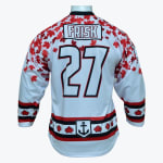 Back view of a white hockey jersey with the name FRISK and number 27, decorated with red maple leaves and an anchor logo on the hem.