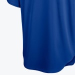 Close-up of a vibrant royal blue athletic jersey with a textured knit fabric and curved hem against a white background.