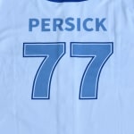 The back of a light blue sports jersey featuring the name PERSICK in blue capital letters and the number 77 in blue with a dark blue outline.