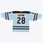 The back of a light blue hockey jersey with the name SITNIK and the number 28 in purple and gold, displayed on a white background.