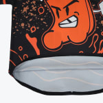 Close-up of the curved bottom hem of a black and orange athletic shirt featuring an angry cartoon character graphic and a light grey inner lining.