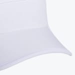 A close-up shot of the curved brim and front panel of a solid white visor cap.