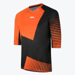 An orange and black athletic jersey with a geometric block design, striped sleeves, and a white logo on the chest, shown against a plain white background.