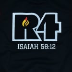 An embroidered R4 logo with a yellow and red flame inside the R, outlined in light gray on a black fabric background, with ISAIAH 58:12 embroidered in white below.