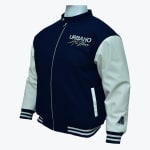 A navy blue varsity jacket with off-white sleeves, a zipper front, and URBANO All Stars embroidered on the chest, shown on a mannequin.