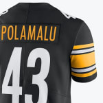 Close-up of the back of a black Pittsburgh Steelers jersey with POLAMALU and the number 43 in white.