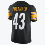 The back of a black Pittsburgh Steelers jersey showing the name POLAMALU in gold and the number 43 in white.