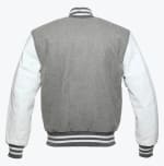 The back view of a grey wool varsity jacket with white leather sleeves and striped ribbed trim.