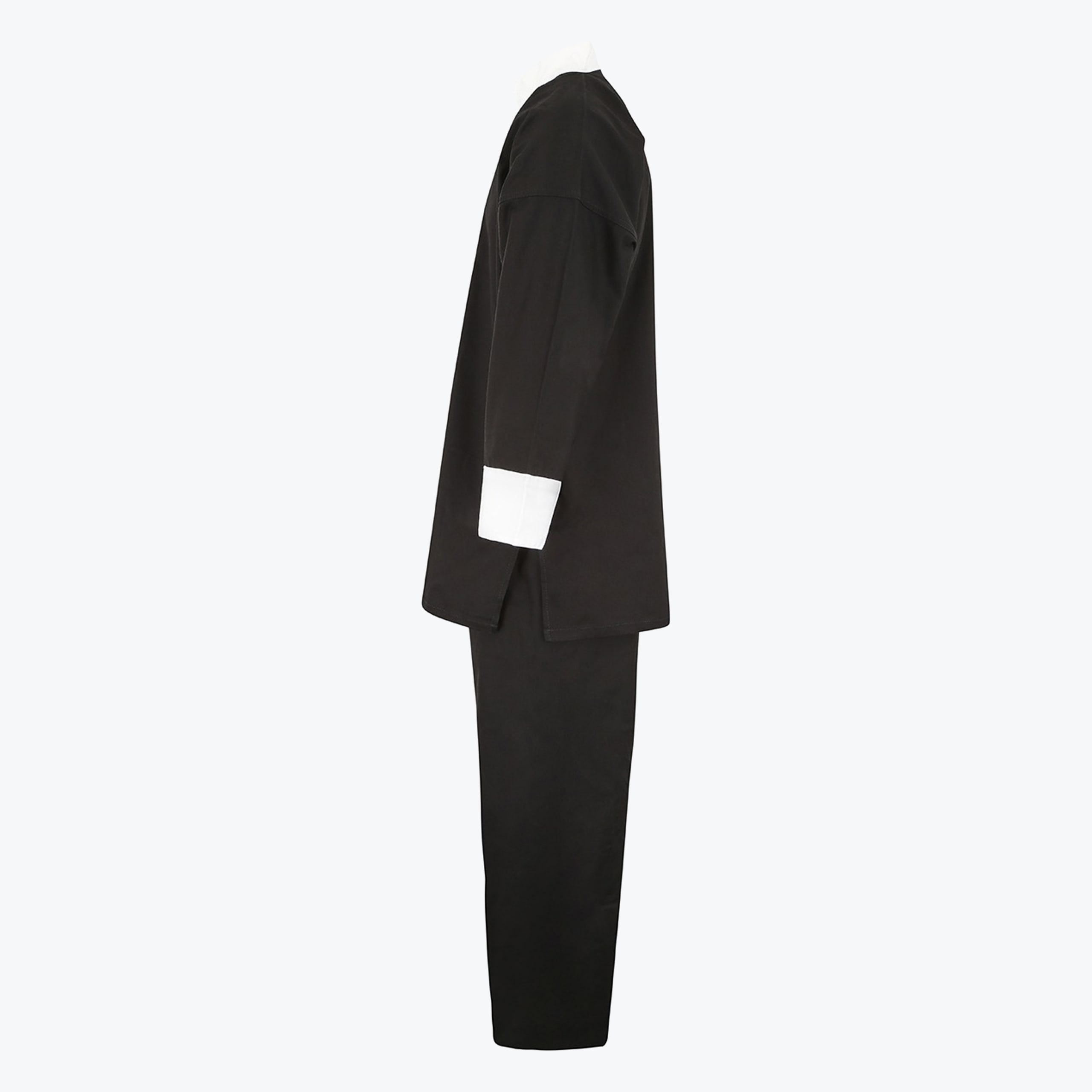 Side view of a black martial arts uniform featuring a long-sleeved tunic with white cuffs and matching black pants on a white background.