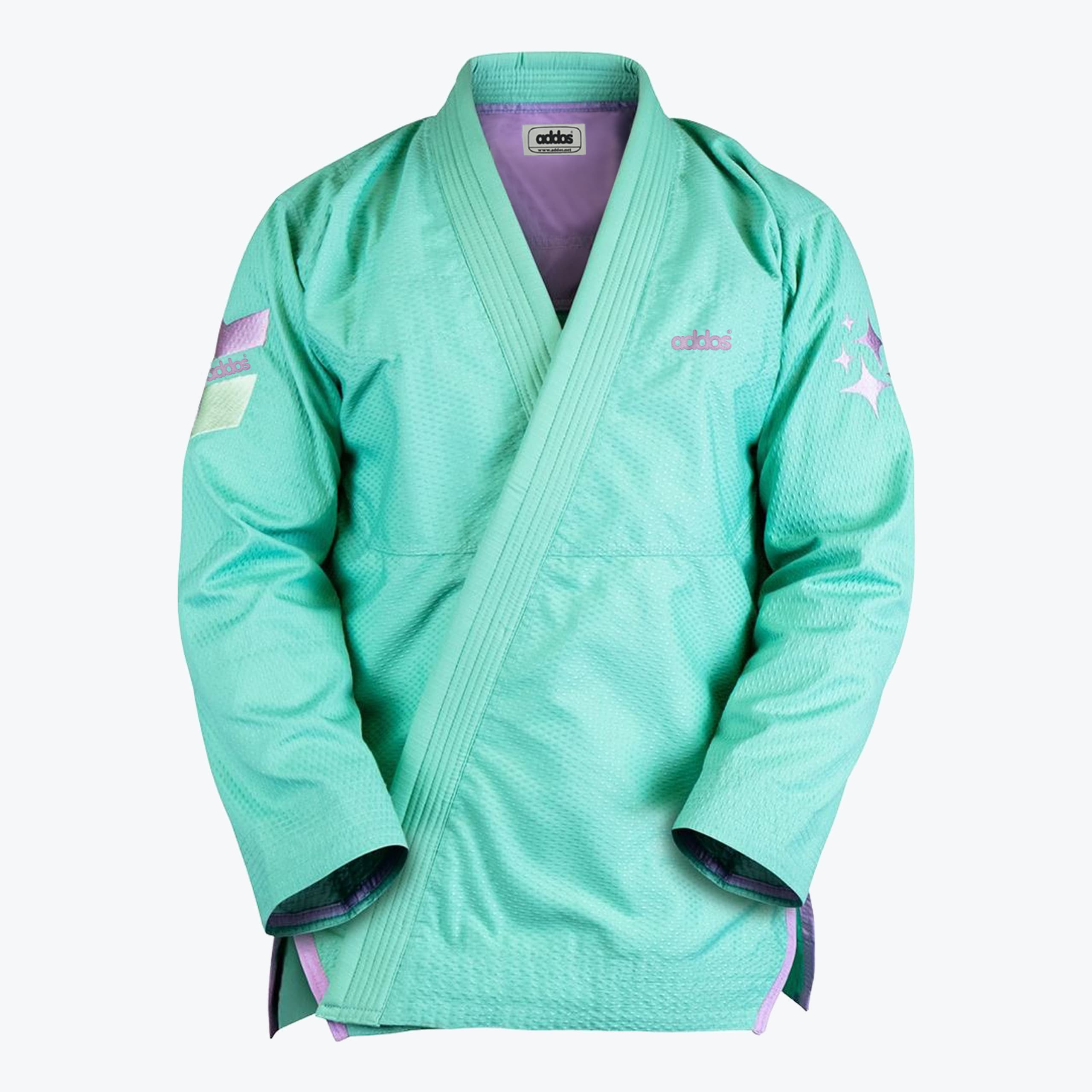 Addos Mint Green Jiu-Jitsu Gi Jacket A mint green Addos BJJ gi jacket with pastel purple accents, star embroidery on the sleeve, and a purple interior lining, shown against a white background.