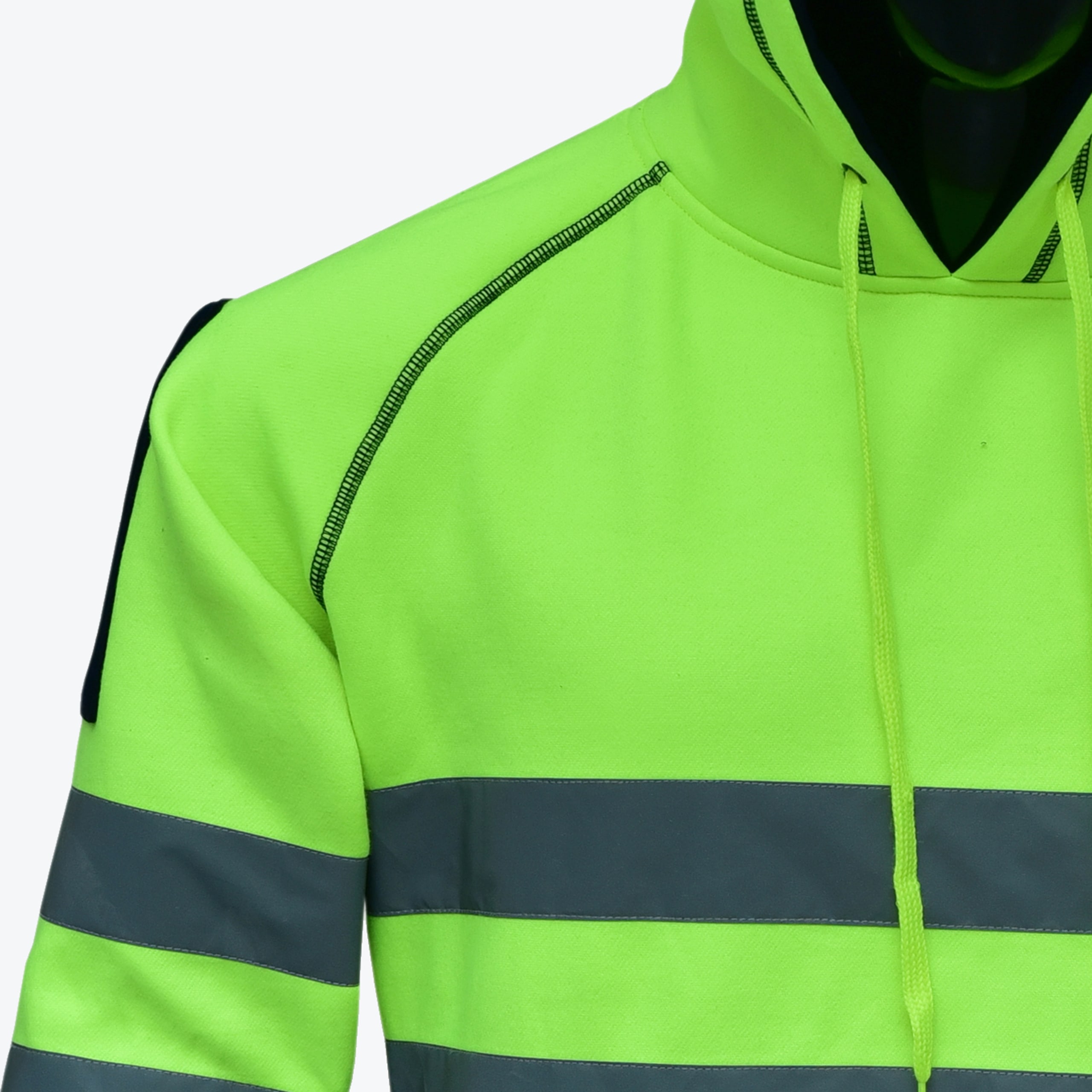 Close-up of a neon green high-visibility safety hoodie with reflective silver stripes and black stitching.