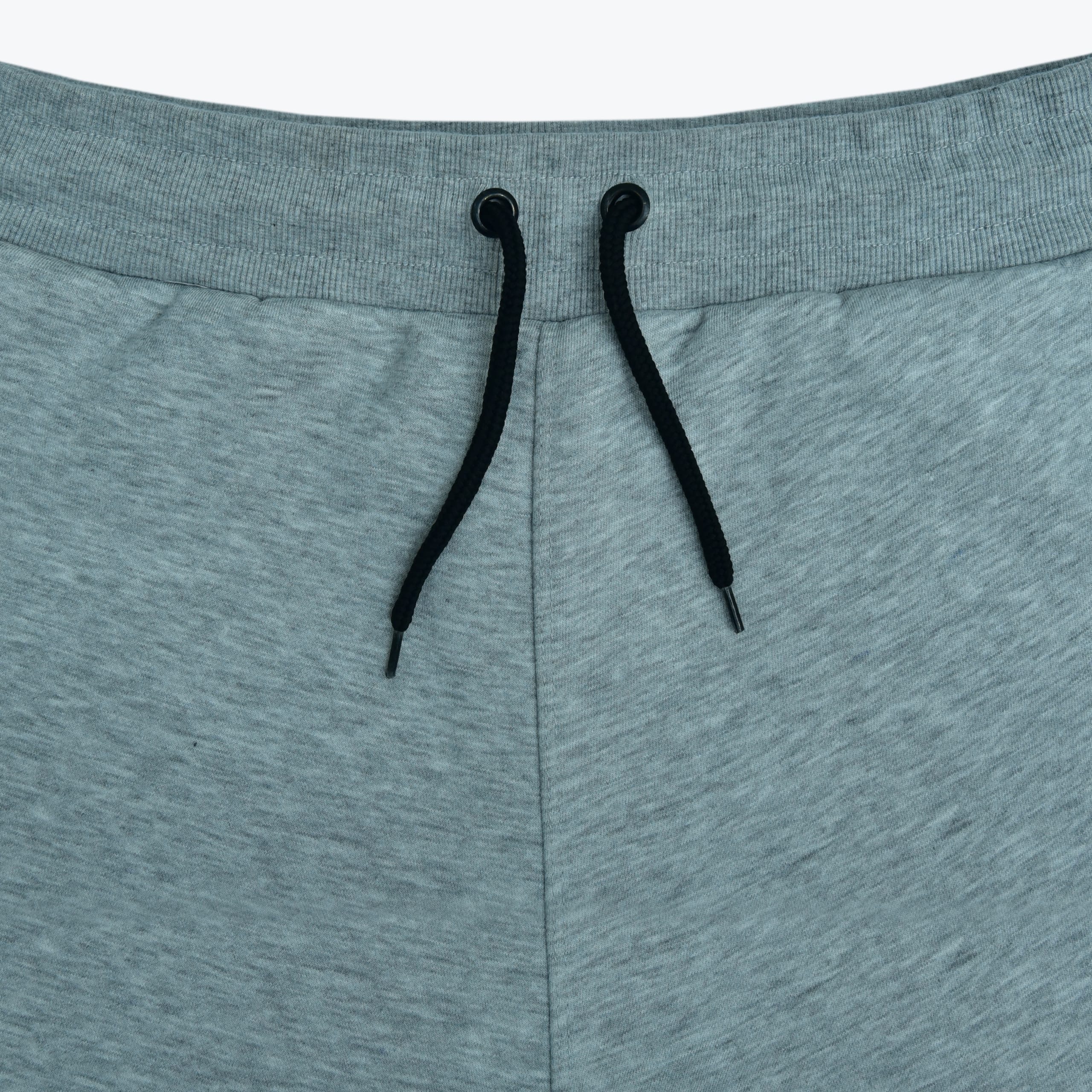 Close-up of a grey heathered sweatpants waistband with black drawstrings.